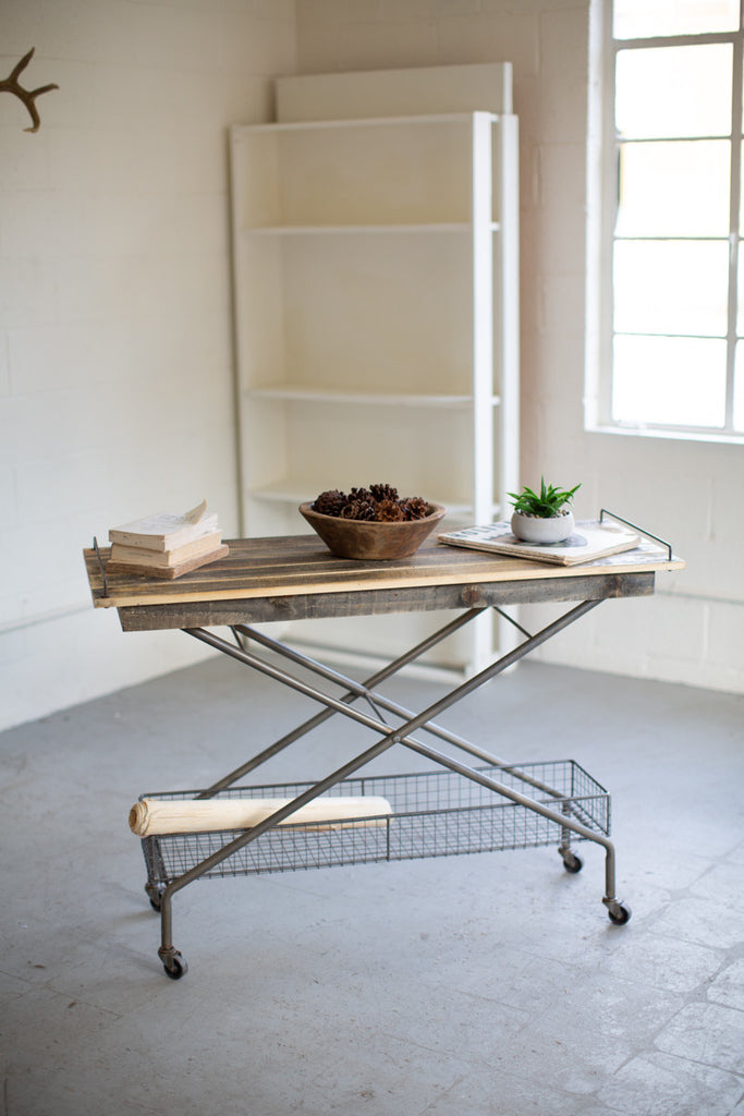 Recycled wood console table with metal base, basket and casters